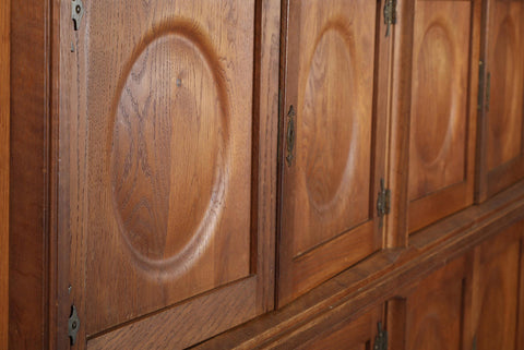 TALL OAK SIDEBOARD WITH EIGHT CIRCULAR DOORS BY HENRY KJAERNULF