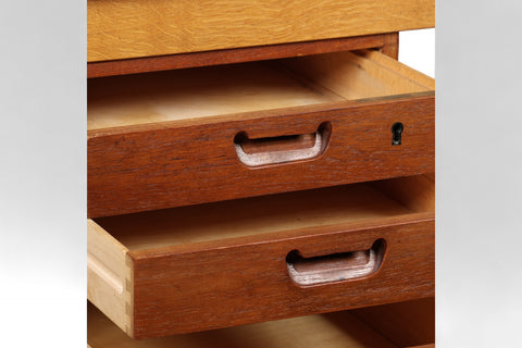 Close-up of teak grain and drawer detail on mid-century writing desk