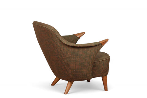 Mid century Danish lowback armchair featuring teak paws