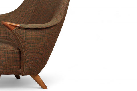 Lowback mid century armchair with distinctive teak paw armrests