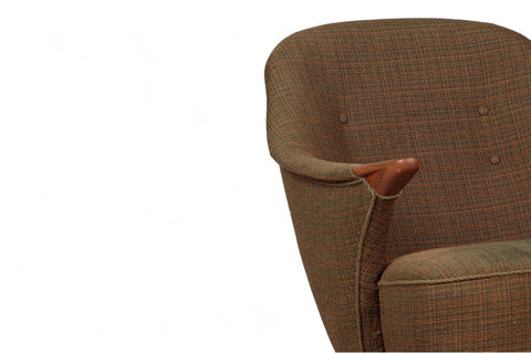 Angular mid century armchair, Danish design with teak paw accents