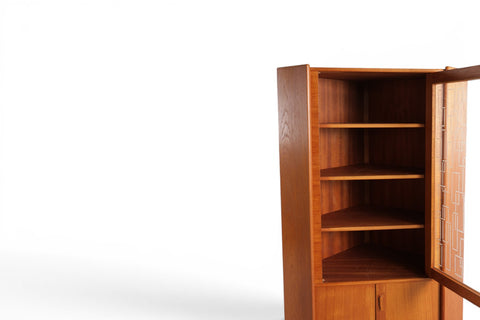 Interior view of Omann Jun teak corner cabinet showing four adjustable shelves — Danish modern 1950s