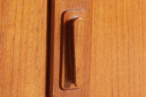 Carved teak finger-pull handle detail — Omann Jun Danish mid century corner cabinet 1950s