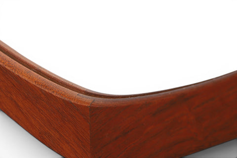 Side detail of 1950s Danish asymmetrical teak wall mirror — atomic age mid century