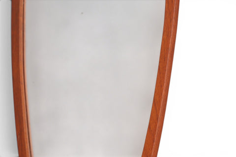 Close-up of teak frame on 1950s Danish atomic asymmetrical wall mirror
