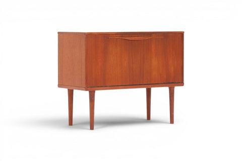 Drop front open on Lyby Møbler 1960s Danish teak cabinet revealing fitted interior