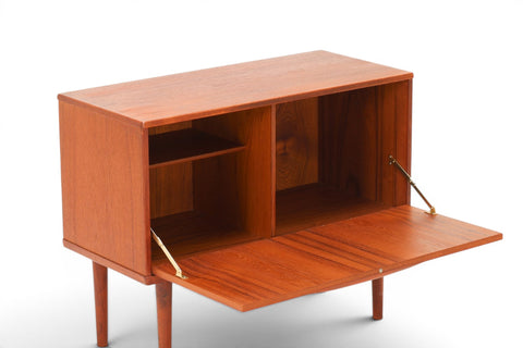Detail of teak joinery and drop front on 1960s Lyby Møbler Danish cabinet