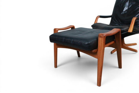 Front view of Arne Wahl Iversen Komfort highback lounge chair in black leather with teak base