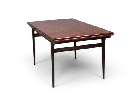 Side view of Johannes Andersen rosewood draw leaf dining table — Uldum Møbelfabrik 1950s