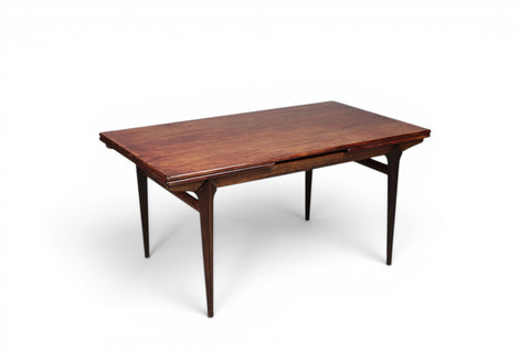 Johannes Andersen jet age dining table extended showing draw leaf mechanism — Danish rosewood 1950s