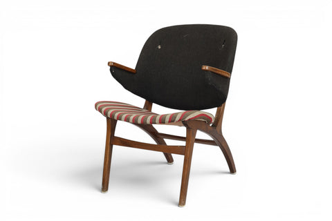 Front view of Carl Edward Matthes Danish lounge chair in beech and wool upholstery