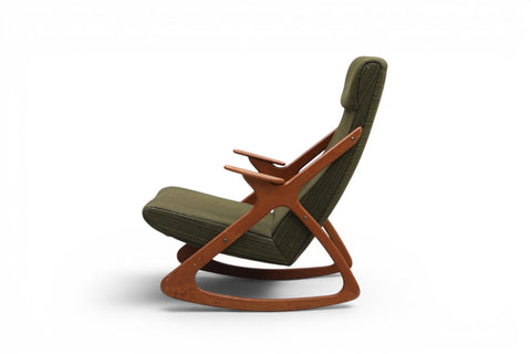 Side profile of 1950s Danish atomic teak highback rocking chair