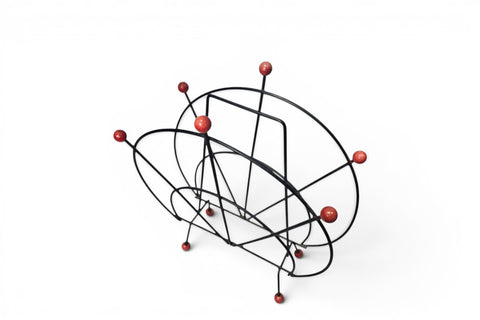 Steel and teak detail on 1950s Danish atomic magazine rack
