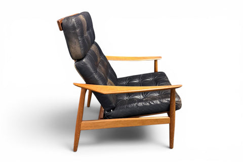 Teak leg and base detail of armchair - 1960s teak leather