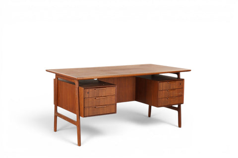Front view of Gunni Omann Model 75 writing desk in teak — 1950s Danish modern