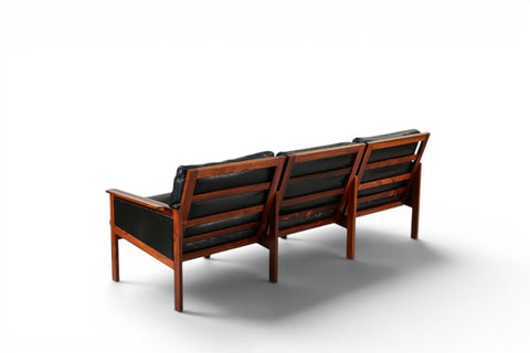 Detail of black leather upholstery and rosewood arm — 1950s-60s Danish modern