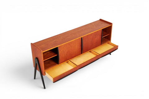 Detail of ebonised legs on Bengt Ruda teak sideboard — mid-century Swedish modern