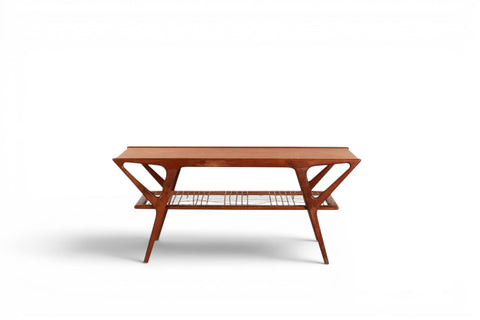 Detail of cane magazine shelf on Danish teak coffee table — 1950s Scandinavian modern