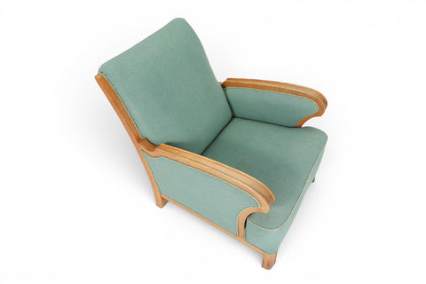 Three-quarter view of 1940s Danish oak lounge chair in seafoam wool — 1940s Scandinavian modern