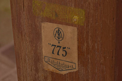 Angled view of Model 775 wedge teak side table by Möbelbolaget Tranås — 1950s Swedish modern