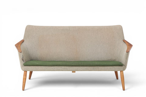 Three-quarter view of Schubell & Madsen wool and teak sofa — 1950s Danish modern