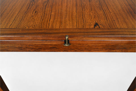 Detail of solid teak small pedestal table highlighting pedestal base.