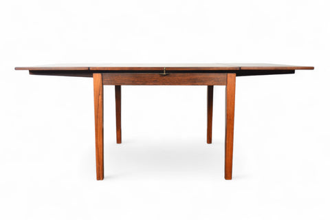 Side profile of solid teak small pedestal table highlighting pedestal base.