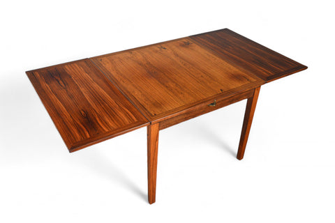 Solid teak small pedestal table with angled pedestal base.