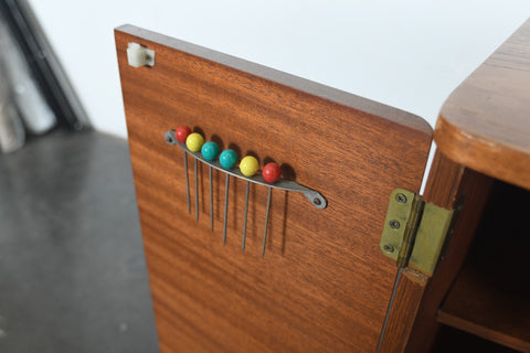 MID CENTURY BOOKCASE WITH ROTATING HIDDEN BAR