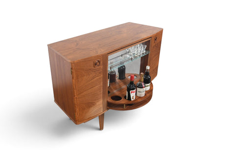 MID CENTURY BOOKCASE WITH ROTATING HIDDEN BAR