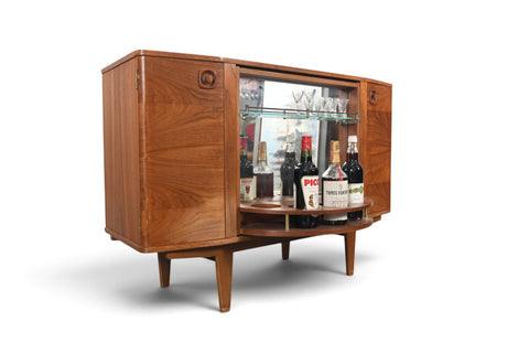 MID CENTURY BOOKCASE WITH ROTATING HIDDEN BAR