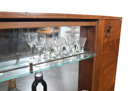 MID CENTURY BOOKCASE WITH ROTATING HIDDEN BAR