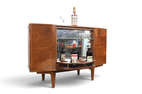MID CENTURY BOOKCASE WITH ROTATING HIDDEN BAR
