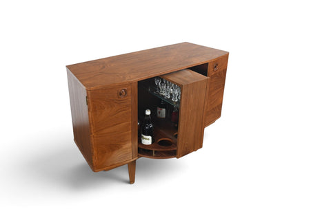 MID CENTURY BOOKCASE WITH ROTATING HIDDEN BAR
