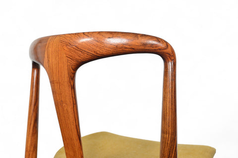 Wooden chair with a curved backrest on a white background