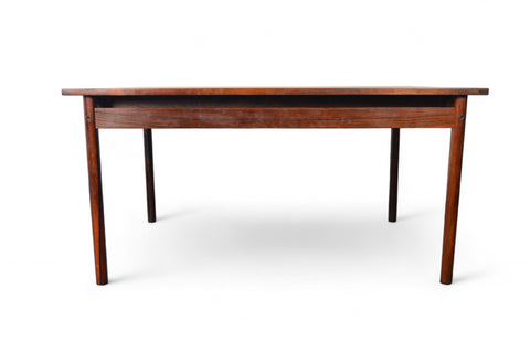 Dining table crafted in Brazilian rosewood, leaves stored inside for a streamlined profile.
