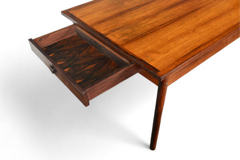 Detail view of the table grain and joinery, emphasizing refined craftsmanship and leaf storage.