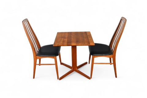 Solid teak small pedestal table with angled pedestal base.