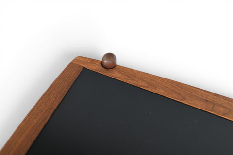 Vintage Danish bar cart, walnut frame with black laminate surfaces, detail view