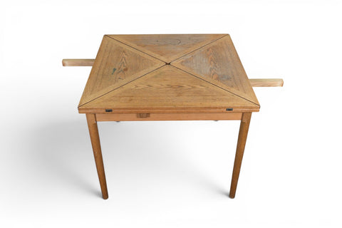 Danish modern oak dining table, expanding leaf extension shown open, side view