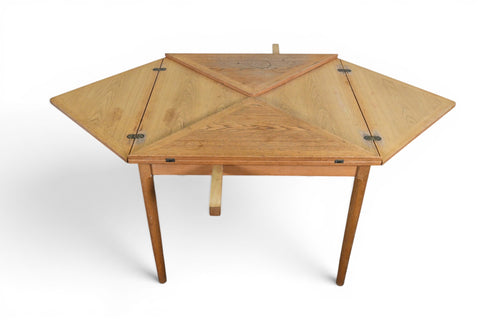 Danish modern card and dining table in oak, triangular leaves folded, angled view