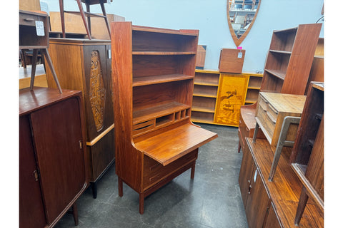 Mid-century modern bookcase with integrated drop-front desk for compact home offices