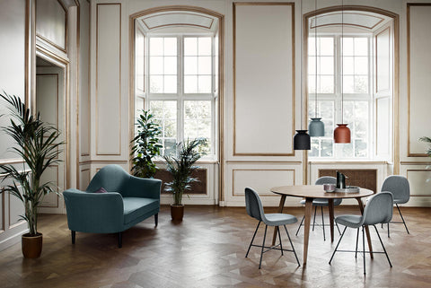 Gubi round wood dining table in dining room