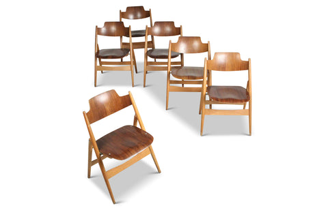 Vintage folding dining chairs by Egon Eiermann, angled group composition
