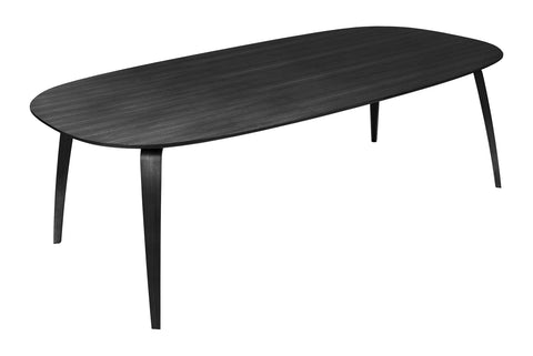 Gubi elliptical dining table with a Black Stained Ash Semi Matte Lacquered finish